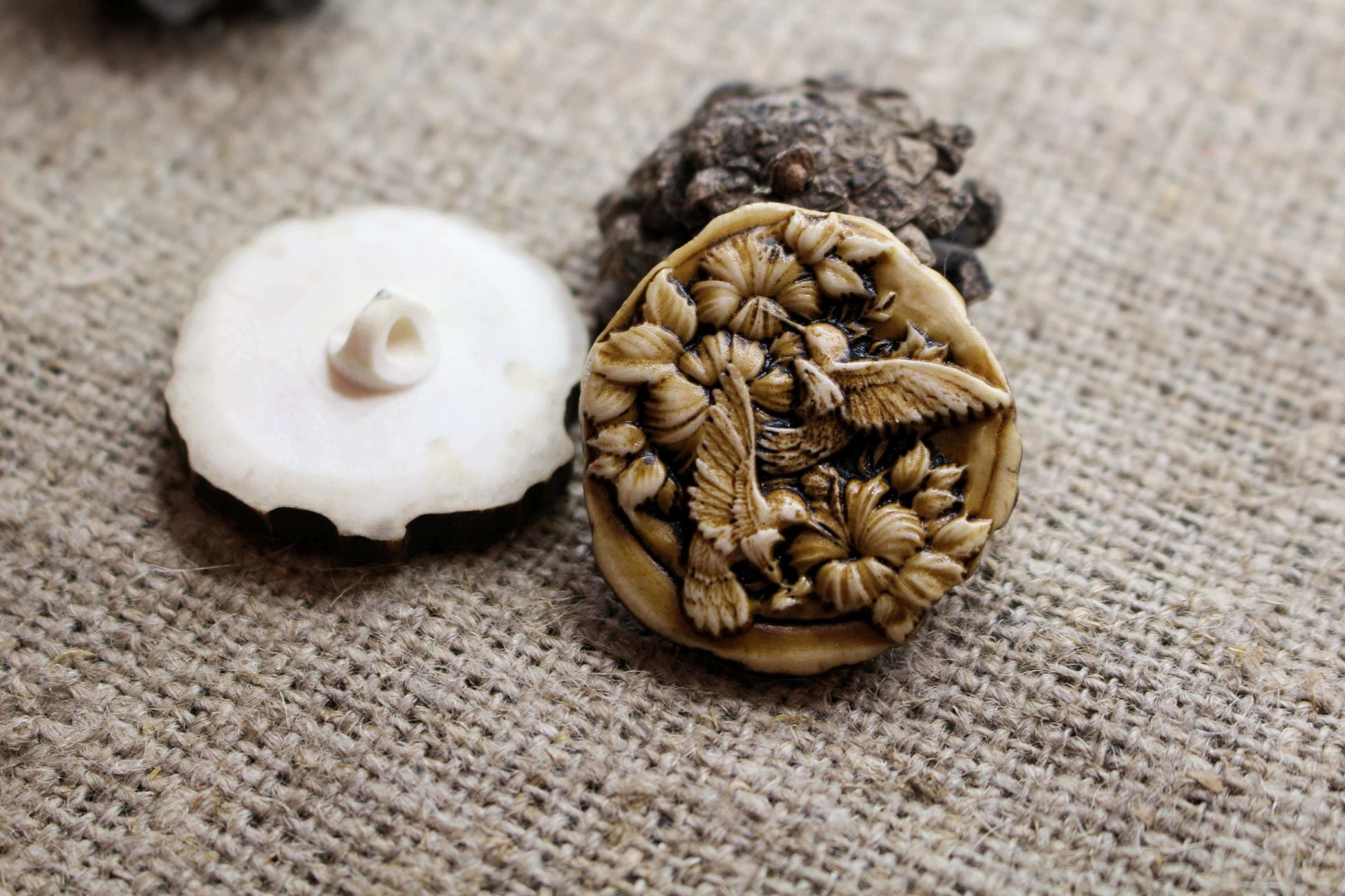 Handcrafted sewing buttons with engraved detail on natural antler