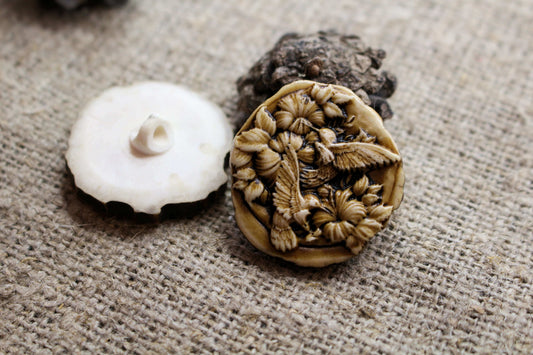 Handcrafted sewing buttons with engraved detail on natural antler