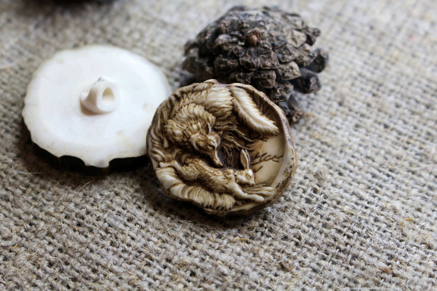 Intricate engraving on handcrafted deer antler sewing buttons