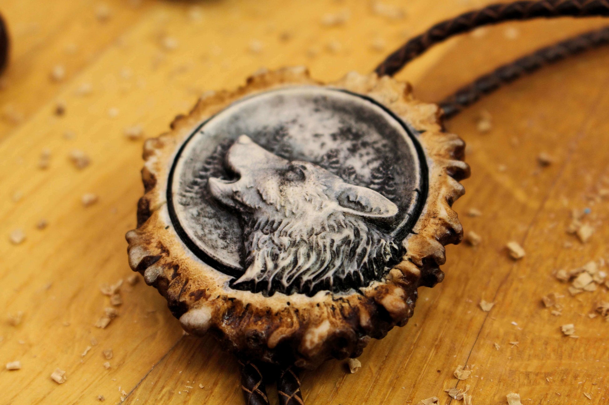 Side picture of Bolo Tie with Howling Wolf image