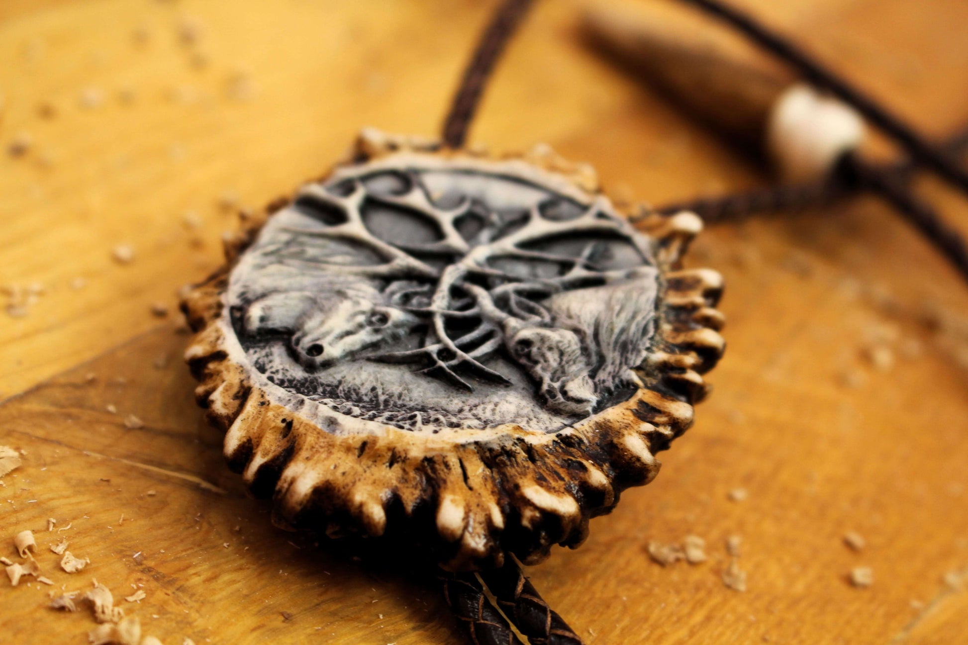 Antler Bolo tie side shot with Fighting Deer design