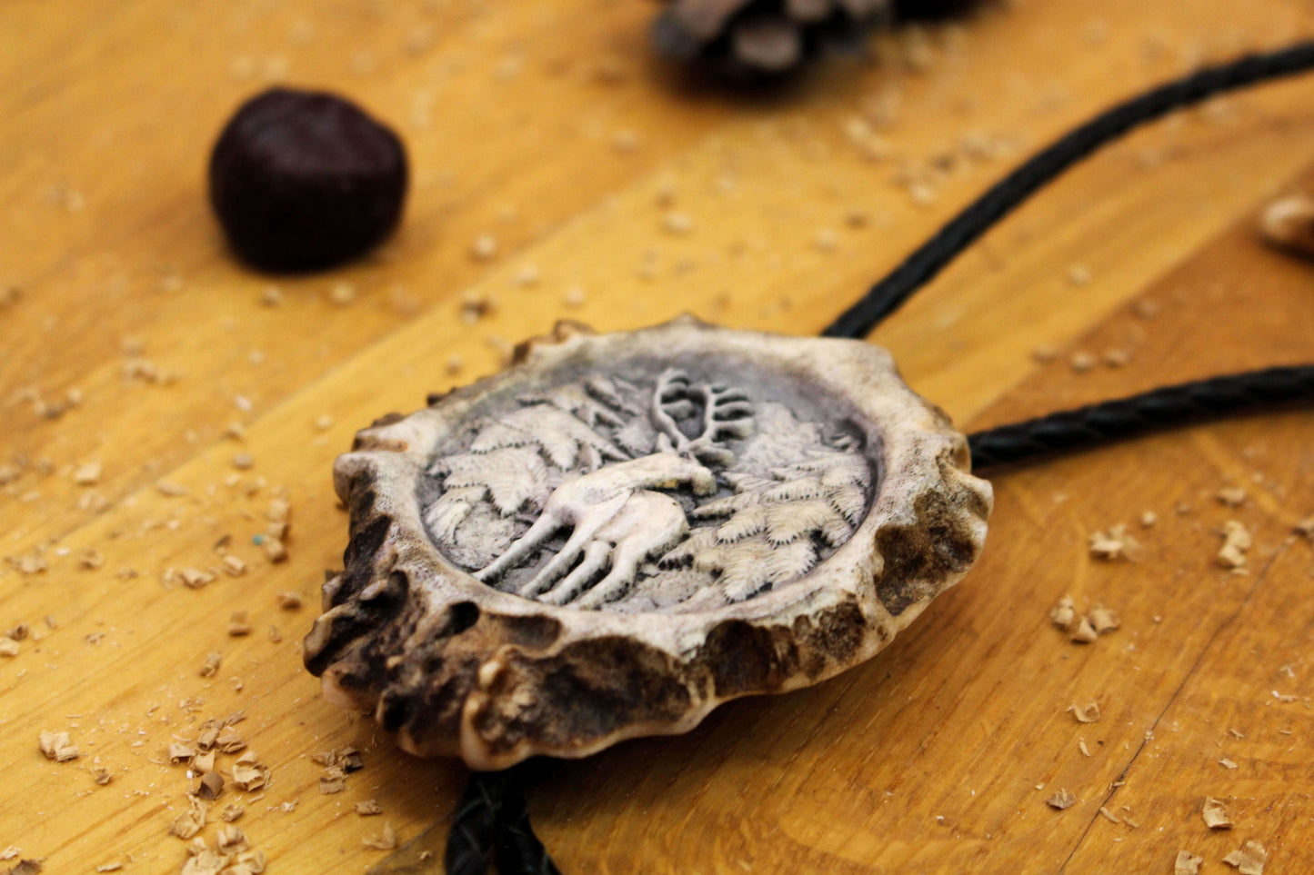 Side picture of Bolo Tie with Standing Deer design and leather cord