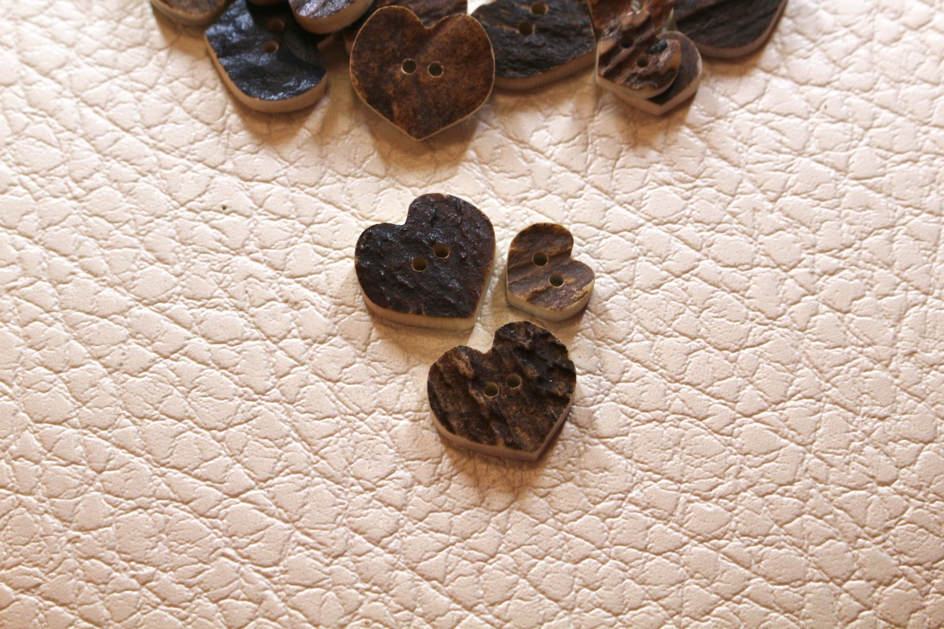 Deer antler buttons shaped like hearts