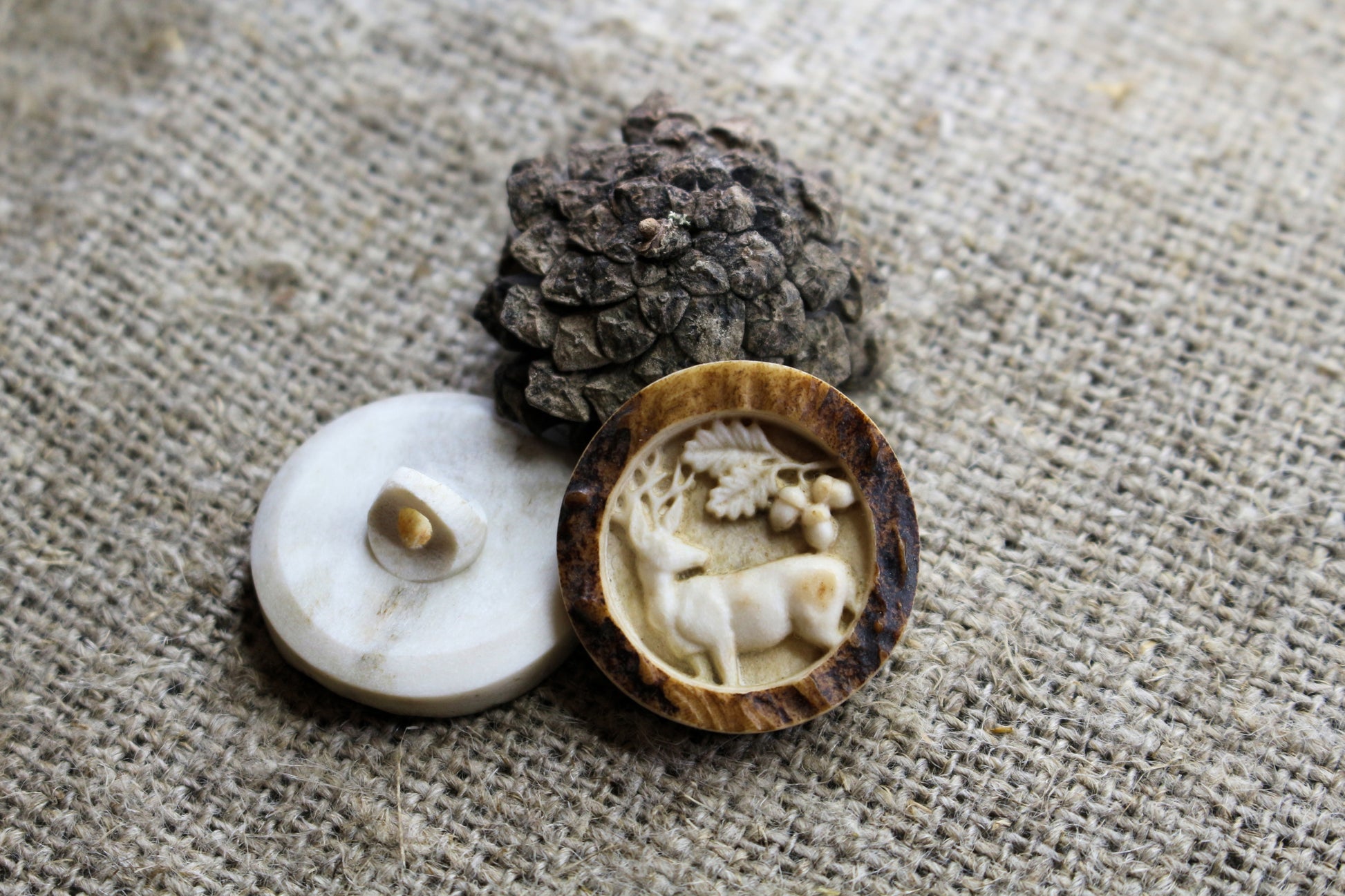 Artistic deer antler sewing buttons adorned with engraved detail