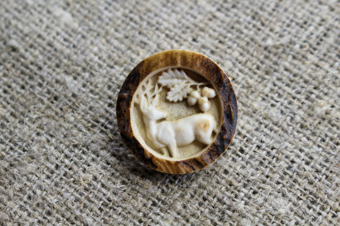 Handmade antler sewing buttons showcasing intricate engraving