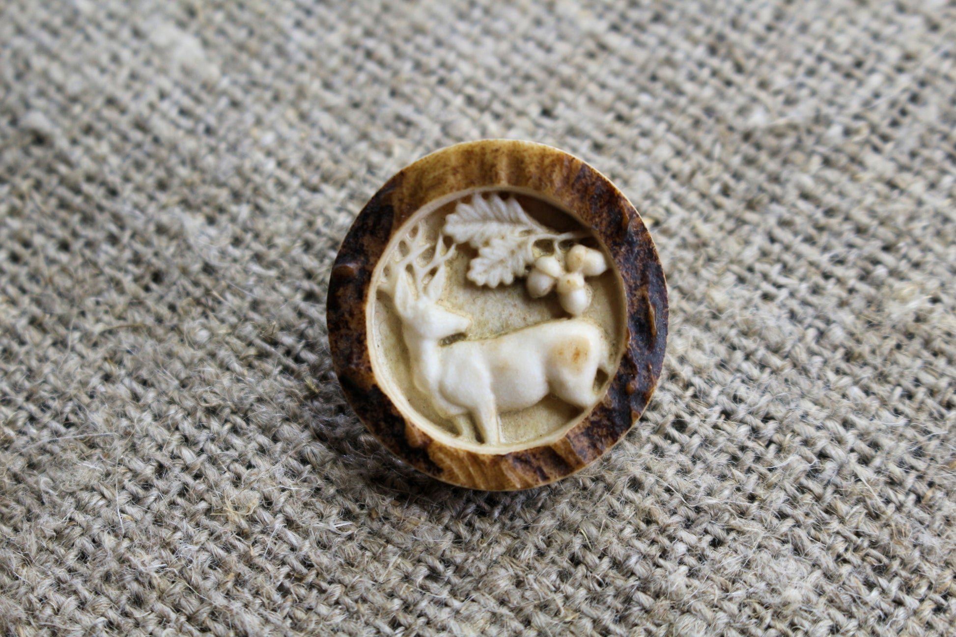 Handmade antler sewing buttons showcasing intricate engraving