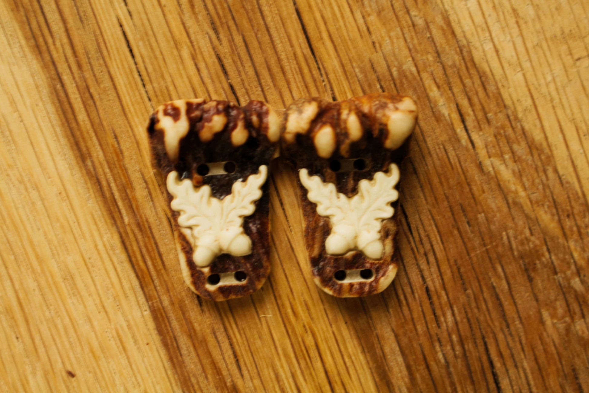 Handcrafted deer antler sewing buttons with intricate engraving