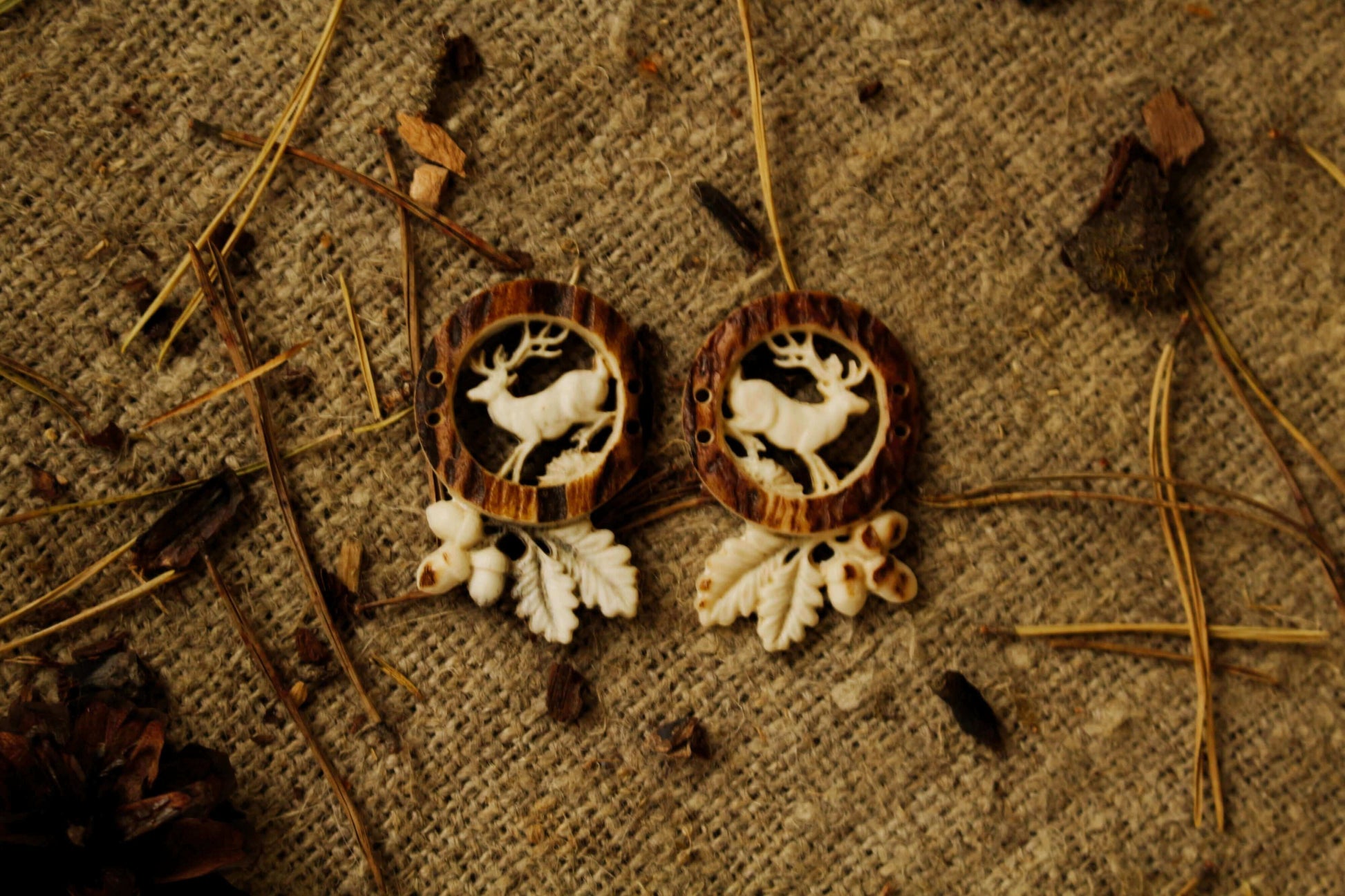 Engraved design on one-of-a-kind deer antler sewing buttons