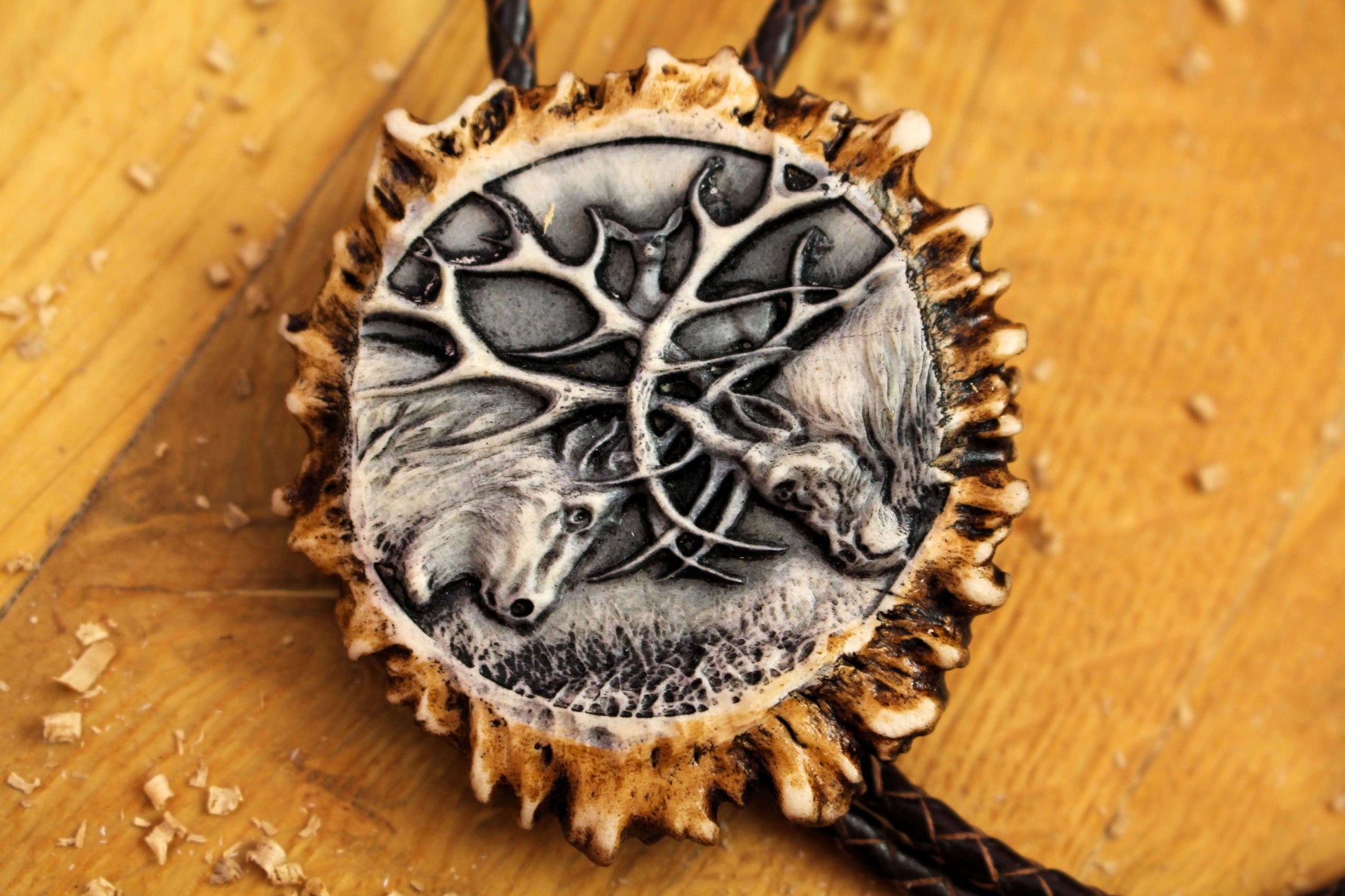 Bolo Tie with a zoomed-in on Fighting Deer Design