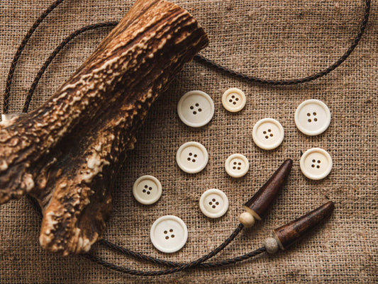 Bone sewing buttons with 4 holes
